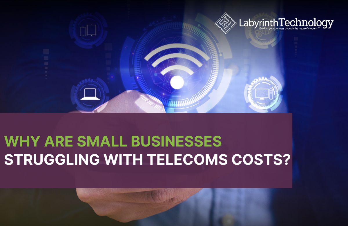 There is a business man holding a phone with a wifi symbol above it. the text reads "Why Are Small Businesses Struggling with Telecoms Costs?" The labyrinth logo is in the top right corner