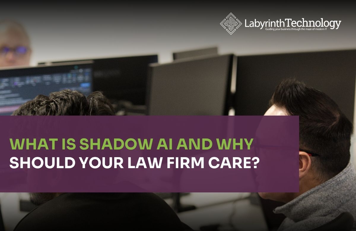 Two men looking at their monitors proactively. The text in the bottom left reads"What Is Shadow AI and Why Should Your Law Firm Care?" The Labyrinth Technology logo is in the top right.